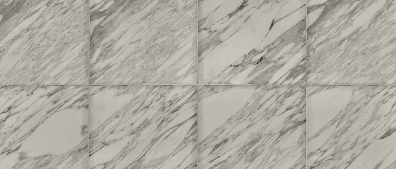 A wall of pale marble in soft light