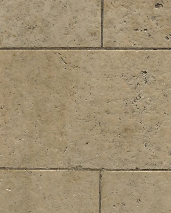 Warm travertine stone in low daylight