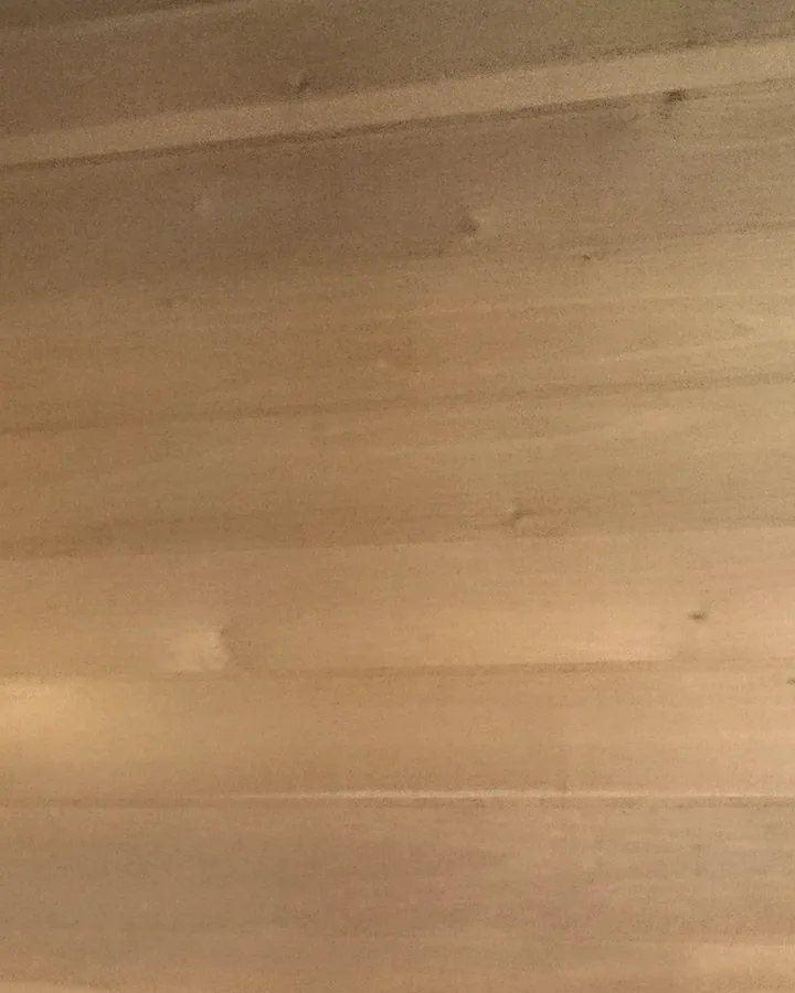 Pale timber boards in quiet, even light